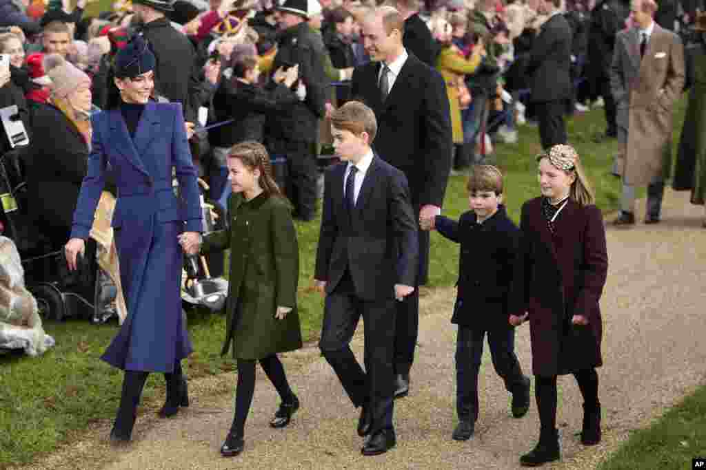 Britain's Kate, Princess of Wales, Princess Charlotte, Prince George, William, the Prince of Wales, Prince Louis and Mia Tindall arrive to attend the Christmas day service at St. Mary Magdalene Church in Sandringham in Norfolk, England.