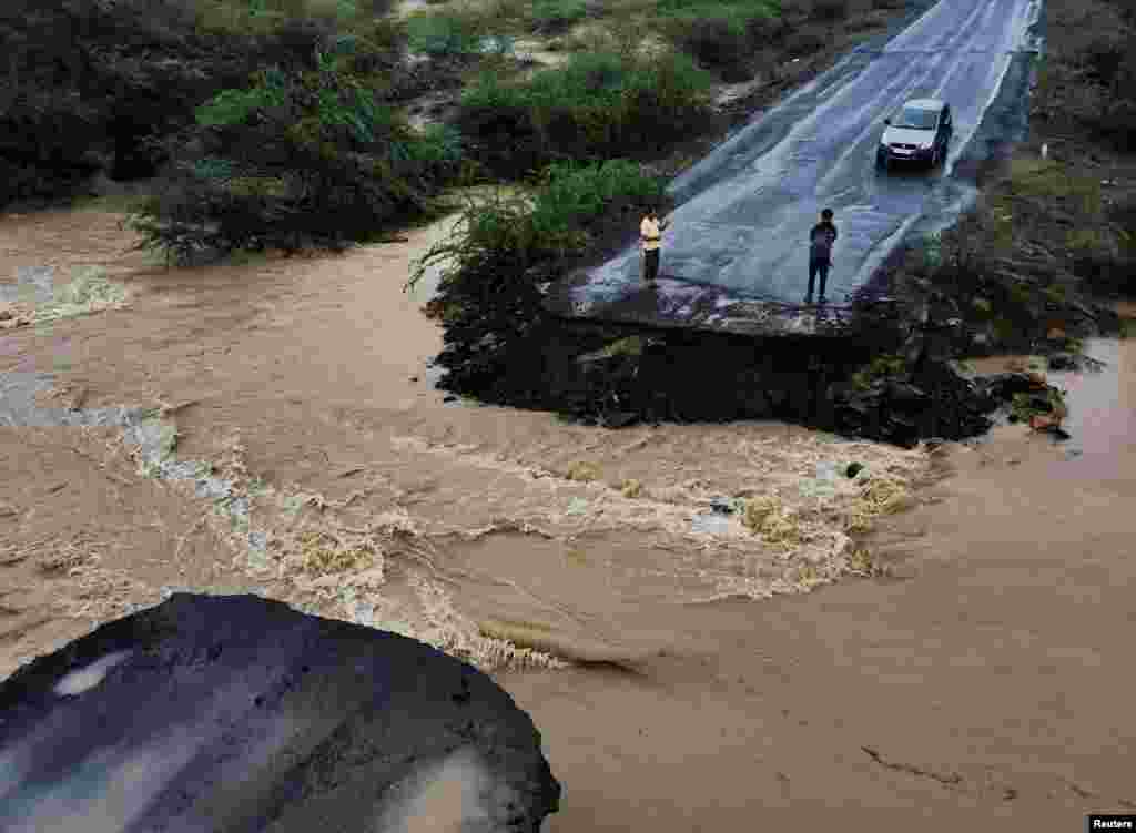 A drone view shows a broken bridge, after Cyclone Biparjoy made landfall, along the Naliya-Bhuj highway, in the western state of Gujarat, India.