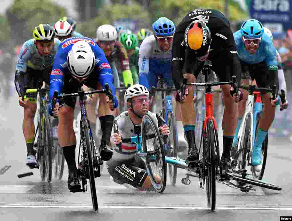 Astana Qazaqstan Team's Mark Cavendish crashes before Alpecin-Fenix's Kaden Groves wins stage 5 of the Giro d'Italia cycling race between Atripalda and Salerno, Italy.