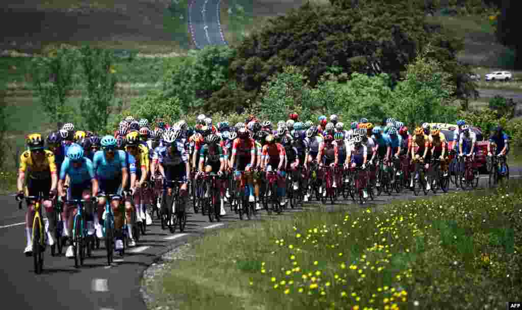 The pack rides during the second stage of the 75th edition of the Criterium du Dauphine cycling race, 167,3 kms between Brassac-les-Mines and La Chaise-Dieu, central France.
