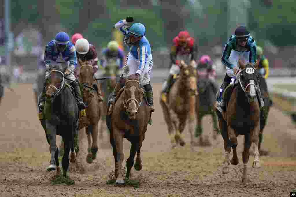 Javier Castellano celebrates after riding Mage to win the 149th running of the Kentucky Derby horse race at Churchill Downs, May 6, 2023, in Louisville, Kentucky.