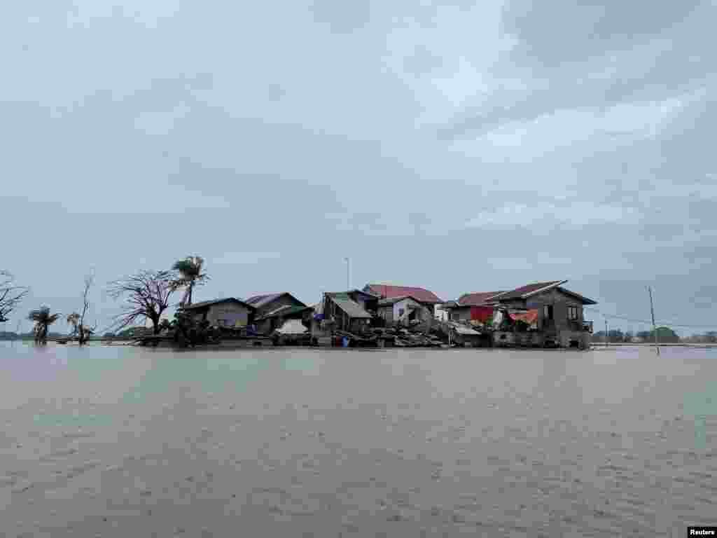 Houses are seen submerged in floodwaters after monsoon rains and a typhoon in Calumpit, Bulacan Province, Philippines.