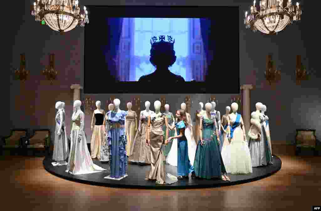 Costumes are pictured during a photocall for an exhibition of props for items used in the filming of the Netflix series 'The Crown' at Bonhams auctioneers in London, ahead of an auction.