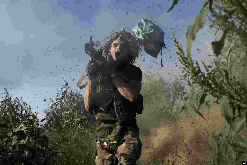 A Ukrainian serviceman of the 53rd brigade fires an RPG-9 toward Russian positions on the frontline close to Donetsk, Ukraine, Aug. 19, 2023.