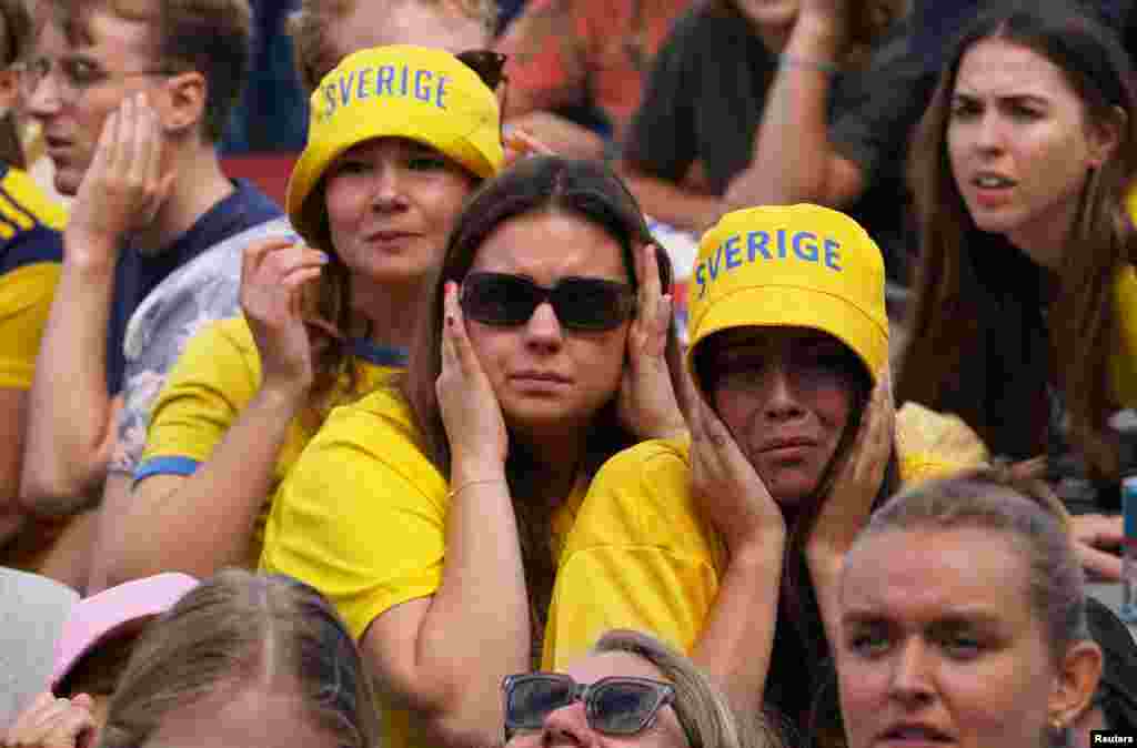 Fans in Stockholm react as they watch the semifinal match between Spain vs. Sweden during the FIFA Women's World Cup Australia and New Zealand.