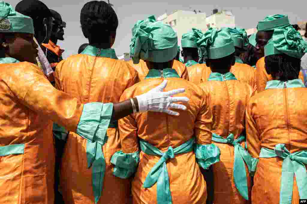 School girls gets ready to take part in celebrations for Senegals 63rd Independence Day in Dakar.
