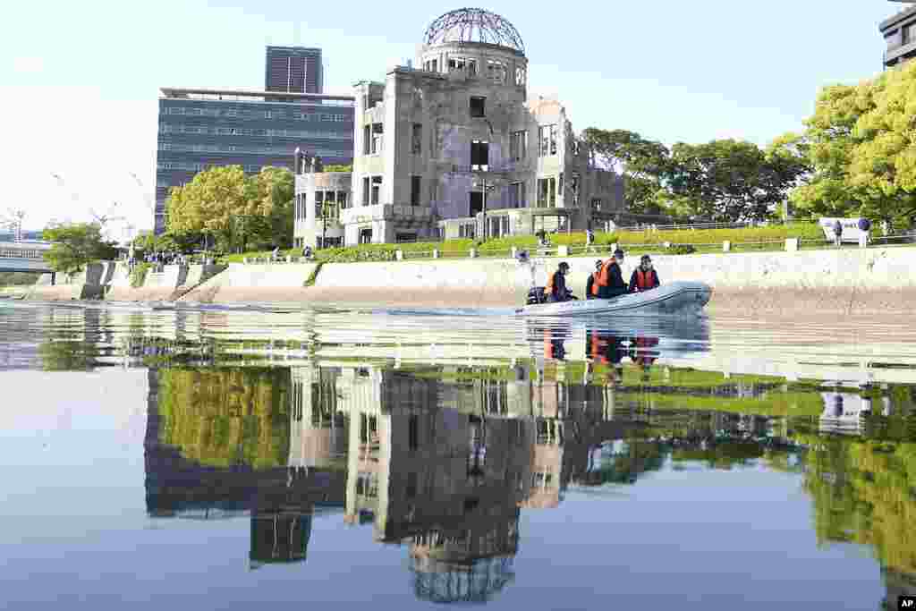 Police officers patrol on the river near the famed Atomic Bomb Dome as Japan's police beef up security ahead of the Group of Seven nations' meetings in Hiroshima, western Japan.