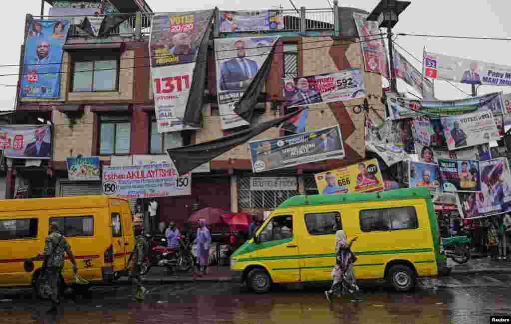 Campaign posters for the upcoming presidential and parliamentary elections are seen on a building in Kinshasa, Democratic Republic of Congo.