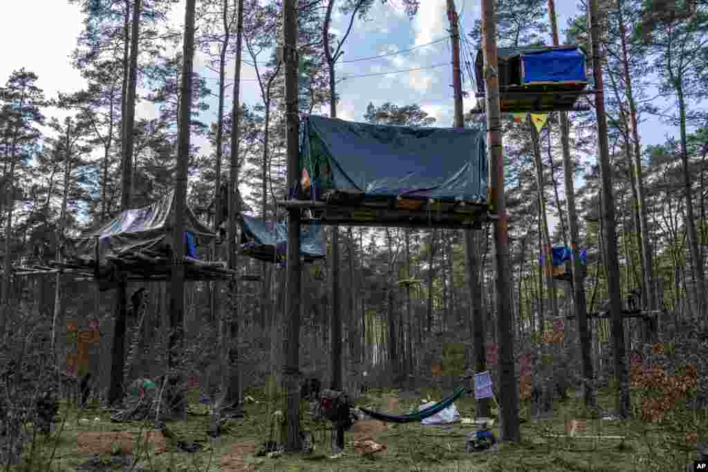 A view of tree houses set up by activists near the Tesla Gigafactory for electric cars in Gruenheide near Berlin, Germany, March 5, 2024. Production at Tesla's electric vehicle plant in Germany came to a standstill and workers were evacuated after a power outage that officials suspect was caused by arson. 