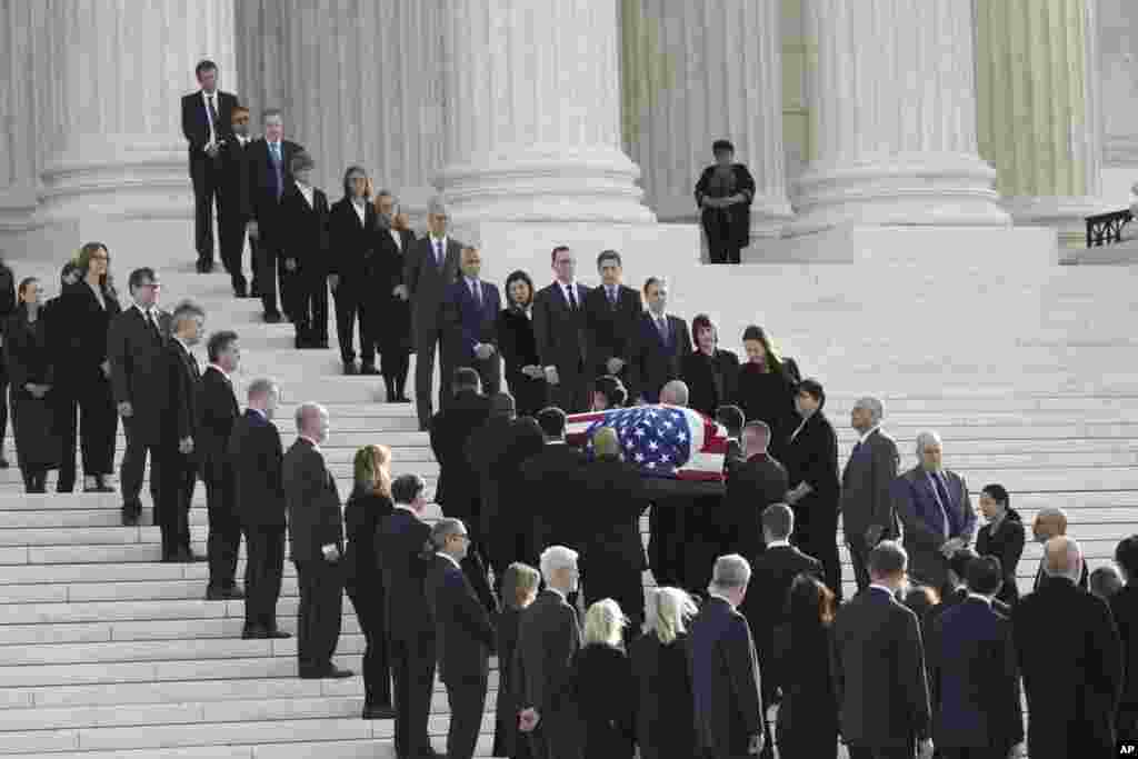 The flag-draped casket of retired Supreme Court Justice Sandra Day O'Connor arrives at the Supreme Court in Washington. O'Connor, an Arizona native and the first woman to serve on the nation's highest court, died Dec. 1 at age 93.
