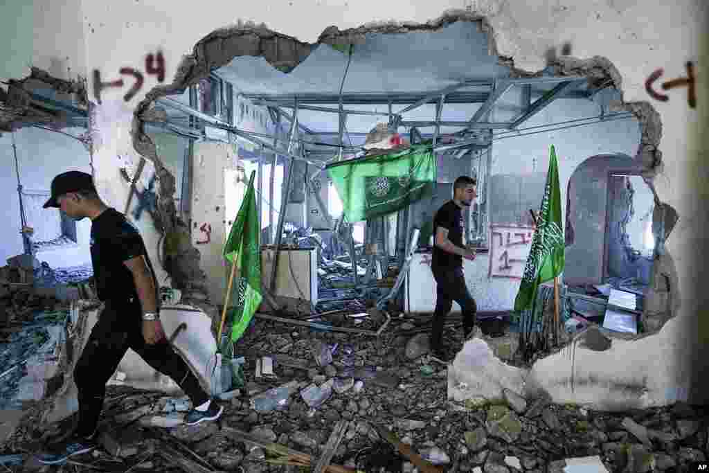 Palestinians inspect the ruins of the home of a Hamas militant that was demolished by Israeli troops in the West Bank village of Naalin.