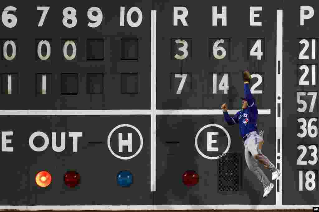 Toronto Blue Jays' Daulton Varsho makes the catch on the fly out by Boston Red Sox's Enmanuel Valdez during the eighth inning of a baseball game, May 3, 2023, in Boston, Massachusetts.