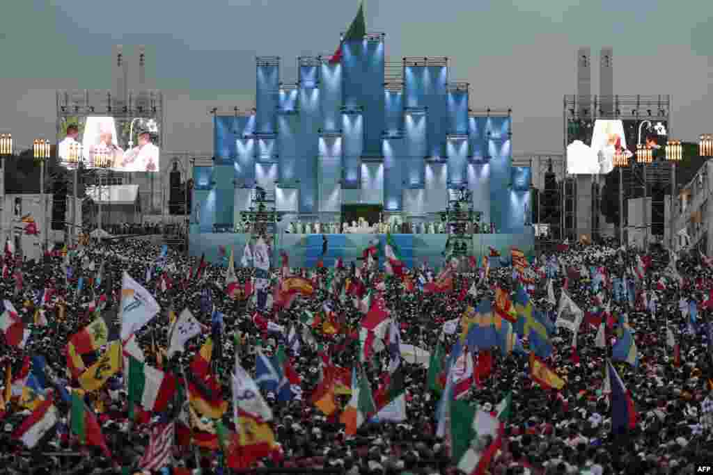 Pilgrims attend the opening Mass of the World Youth Day (WYD) gathering of young Catholics in Eduardo VII Park in Lisbon, Portugal, Aug. 1, 2023.