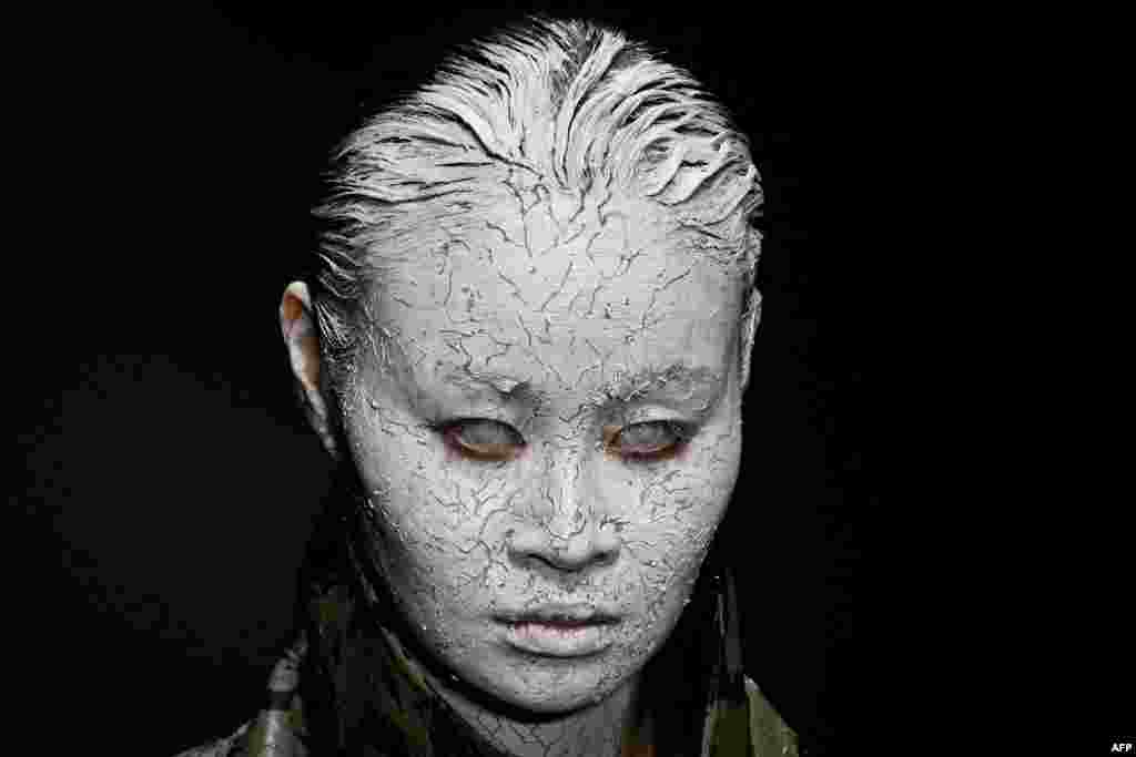 A model displays a creation from the Mi&Go collection by Long Jing during China Fashion week in Beijing.