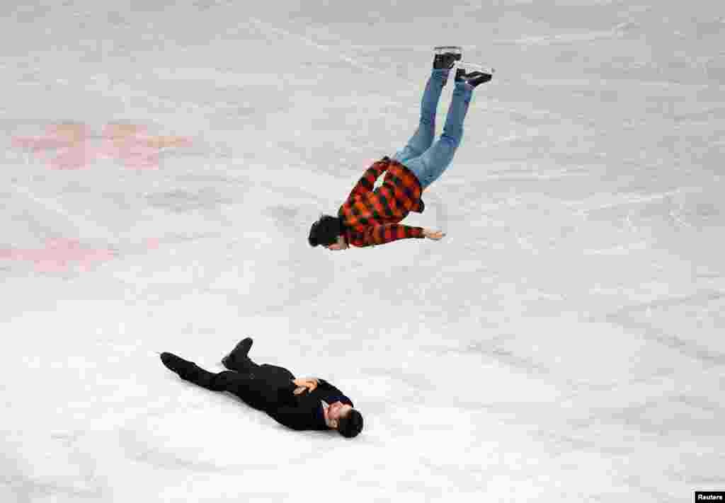 Canada's Keegan Messing backflips over Canada's Maxime Deschamps after the Gala Exhibition at the ISU World Figure Skating Championships 2023 in Saitama , Japan.