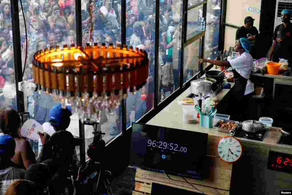 Nigerian Chef Hilda Bassey, 27, attempts to break the Guinness World Record for the longest cooking time by an individual, in Lagos, May 15, 2023.