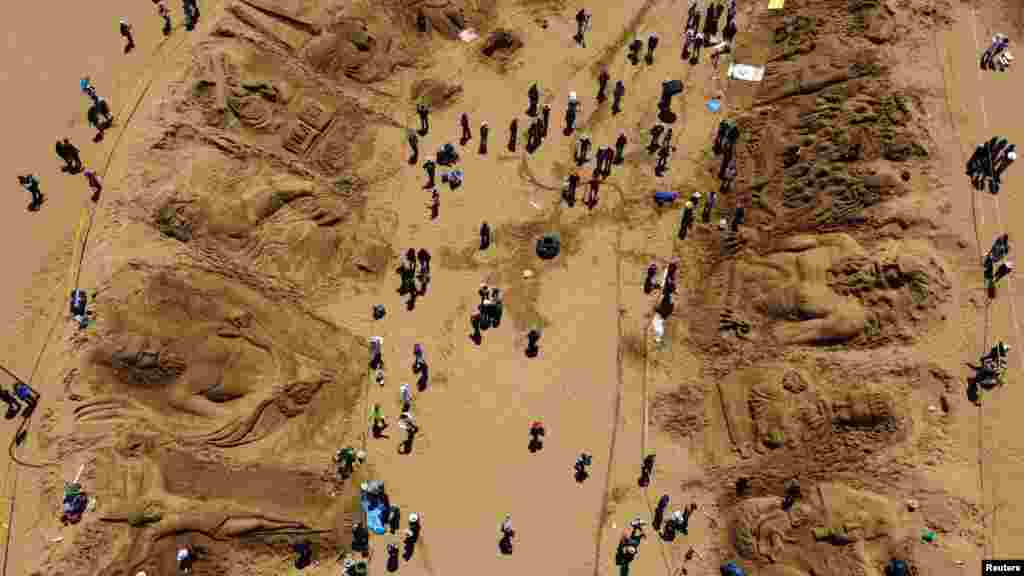 A drone view shows sand sculptures depicting biblical passages during Holy Week celebrations in the Arenal de Cochiraya, on the outskirts of Oruro, Bolivia.