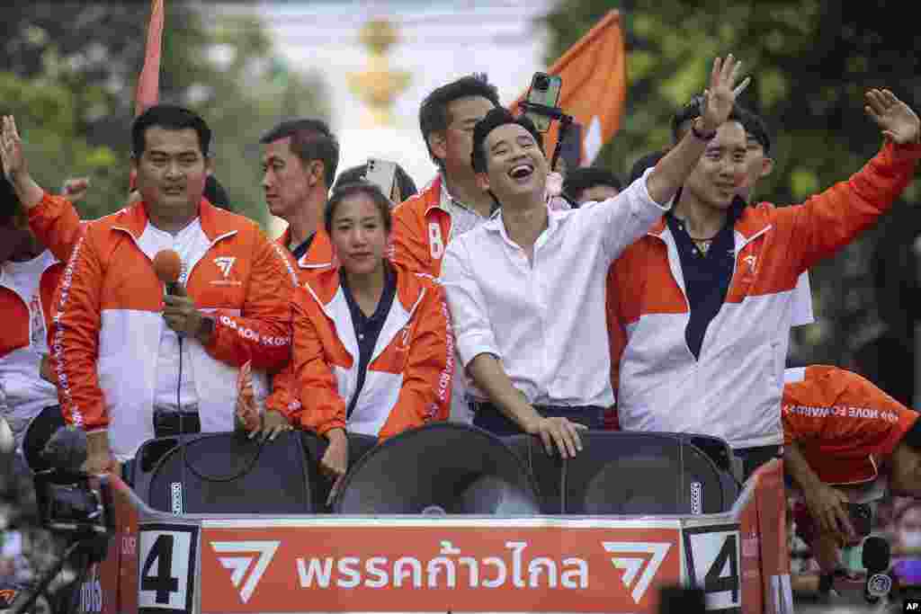 Pita Limjaroenrat, 2nd right, leader of Move Forward Party, waves to his supporters, in Bangkok. Thailand's top two opposition parties began planning for the next stage in their bid to replace the military-dominated government.