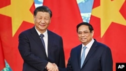 Chủ tịch Trung Quốc Tập Cận Bình và Thủ tướng Việt Nam Phạm Minh Chính.