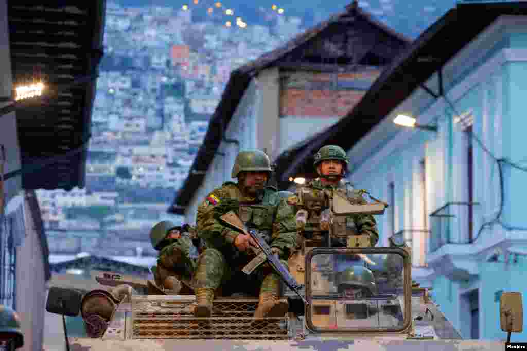 Soldiers in an armored vehicle patrol the city's historic center following an outbreak of violence in Quito, Ecuador, Jan. 9, 2024. President Daniel Noboa declared a 60-day state of emergency following the disappearance of Adolfo Macias, leader of the Los Choneros criminal gang, from the prison where he was serving a 34-year sentence,