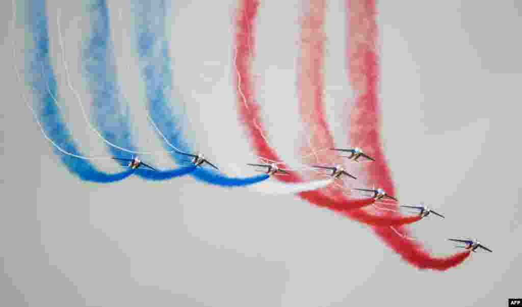 Alphajet aircrafts from the French elite acrobatic flying team "Patrouille de France" perform as they fly over the 701 Air Base in Salon-de-Provence, southern France.
