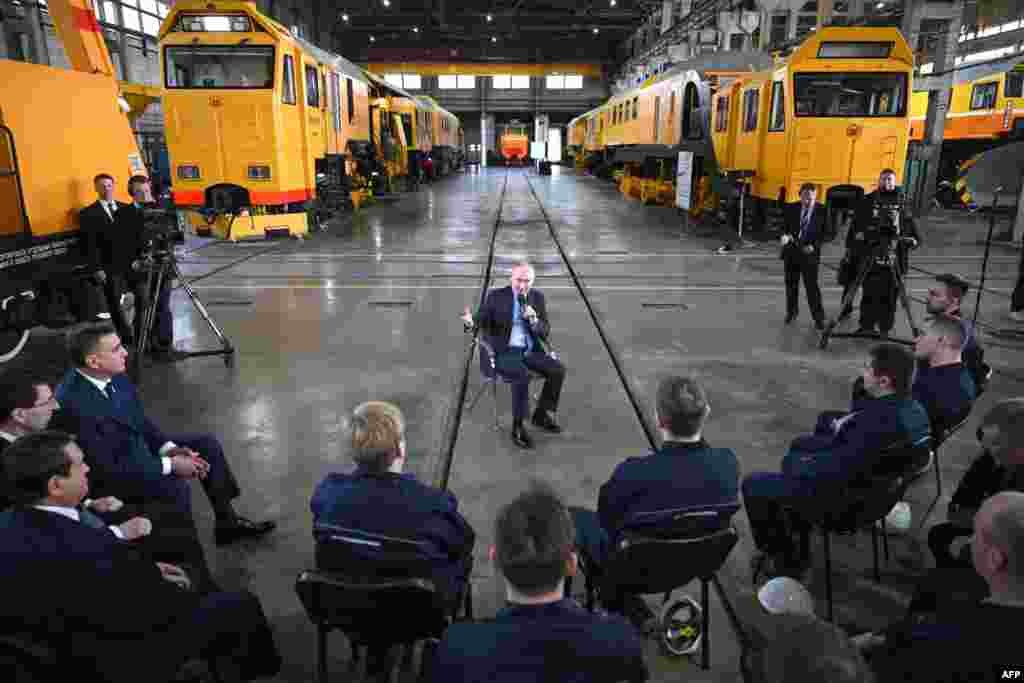 Russian President Vladimir Putin meets with workers as he visits the Tulazheldormash plant, Russia's leading machine-building enterprise, in Tula.