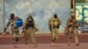 FILE - This undated photo from the French military shows three Russian mercenaries, right, in Mali. Russia's Wagner Group, a private military company, has played a key role in Ukraine fighting and also deployed personnel to the Middle East and Africa.