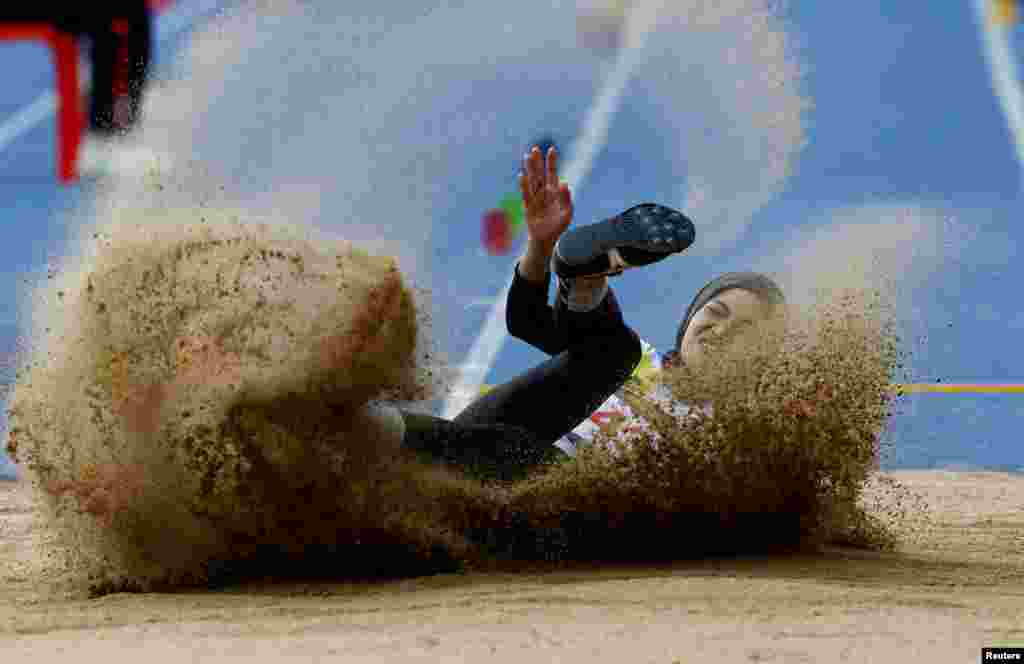 Malaysia's Nurul Ashikin Abas competes in the women's long jump during the 32nd Southeast Asian Games in Phnom Penh, Cambodia.