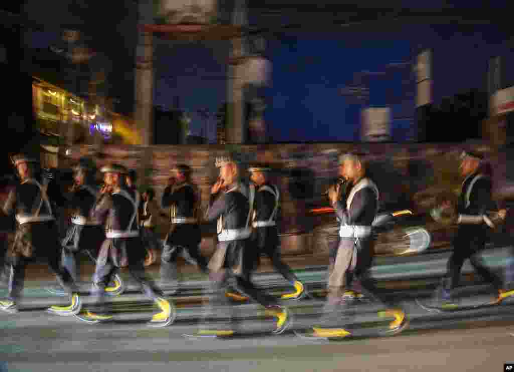 Nepalese soldiers play traditional music during an annual Rato Machindranath chariot festival in Lalitpur, Nepal.