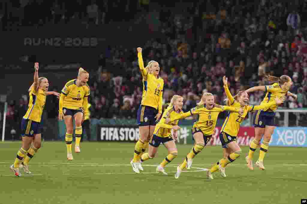 Sweden celebrate after defeating the United States in a penalty shootout in their Women's World Cup round of 16 soccer match in Melbourne, Australia.