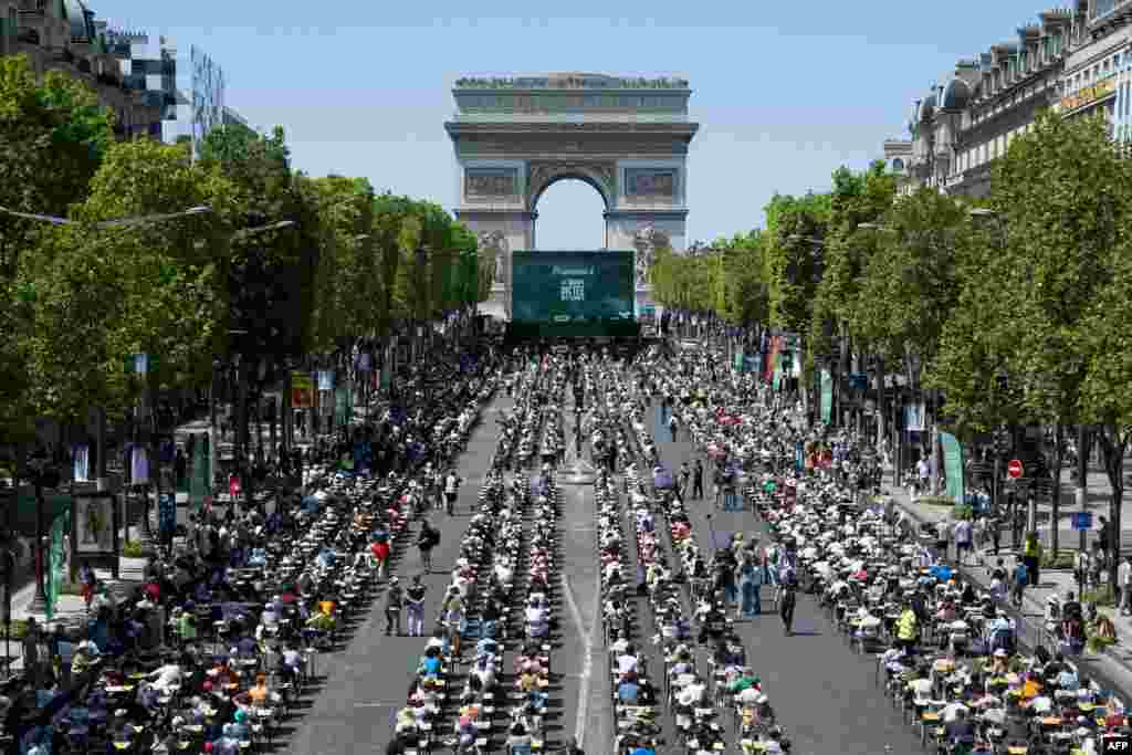 The prestigious Champs-Elysees Avenue, is transformed into a giant classroom hosting participants, as they attempt to beat the record of the "World's Biggest Dictation" in Paris, France.