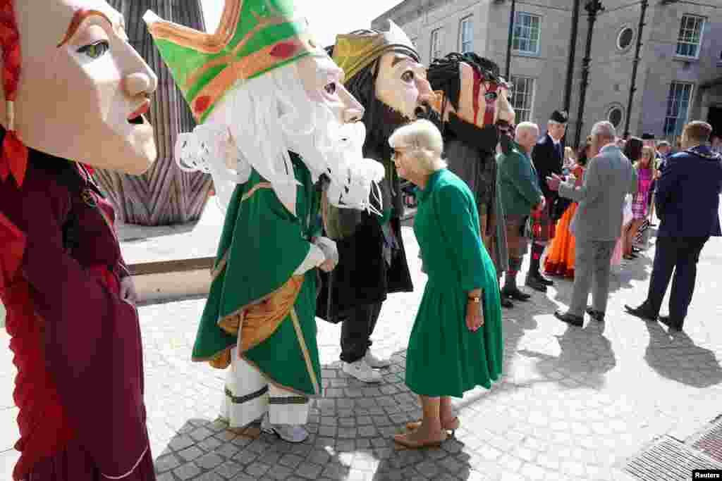King Charles III and Queen Camilla meets characters representing legendary and historical characters associated with Armagh during a visit to Market Theatre Square, Armagh, as part of a two-day visit to Northern Ireland.