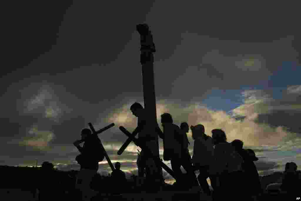 Catholic penitents of the Ujue Virgin carry crosses as they take part in a pilgrimage from Tafalla and other villages to the small town of Ujue, northern Spain, April 30, 2023.
