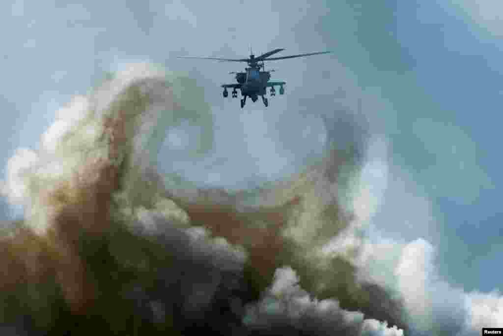 TA military helicopter flies during an amphibious assault exercise as part of the "Cobra Gold 2024" (CG24) joint military exercise at a military base in Chonburi province, Thailand.