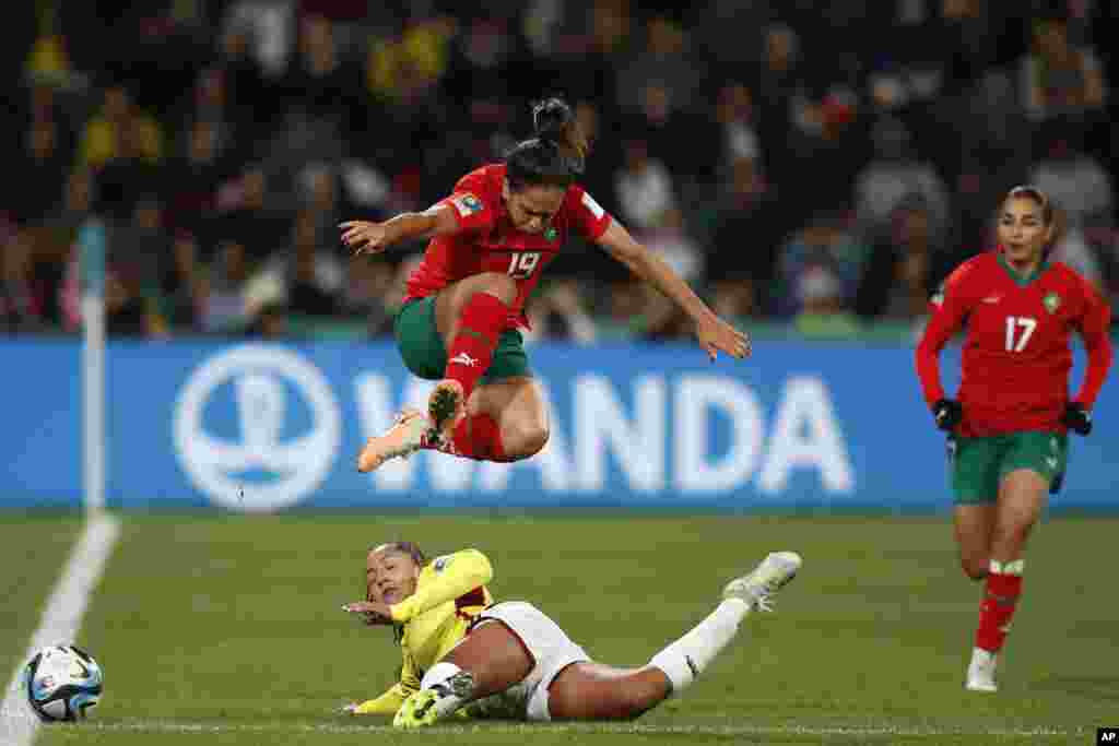 Morocco's Hanane Ait El Haj, right, watches as Colombia's Manuela Vanegas, down, challenges Morocco's Sakina Ouzraoui during the Women's World Cup Group H soccer match between Morocco and Colombia in Perth, Australia. 