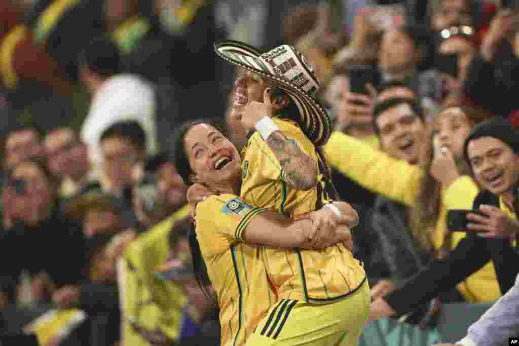 Colombia's Diana Ospina Garcia, left, and Carolina Arias celebrate at the end of the Women's World Cup round of 16 soccer match between Jamaica and Colombia in Melbourne, Australia.