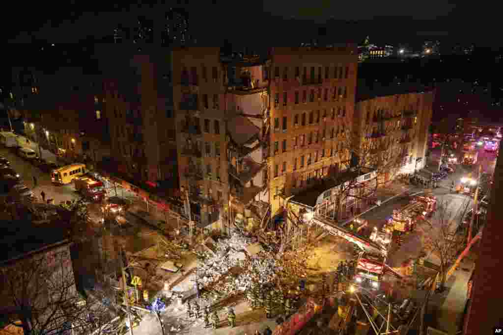 First responders work at the scene of a collapsed building in the Bronx borough of New York, Dec. 11, 2023.