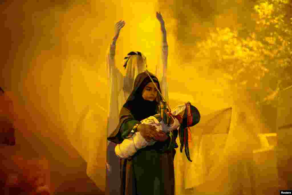 A Shi'ite Muslim child takes part in a ritual ahead of Ashura, the holiest day on the Shi'ite Muslim calendar, in Istanbul, Turkey, July 27, 2023.