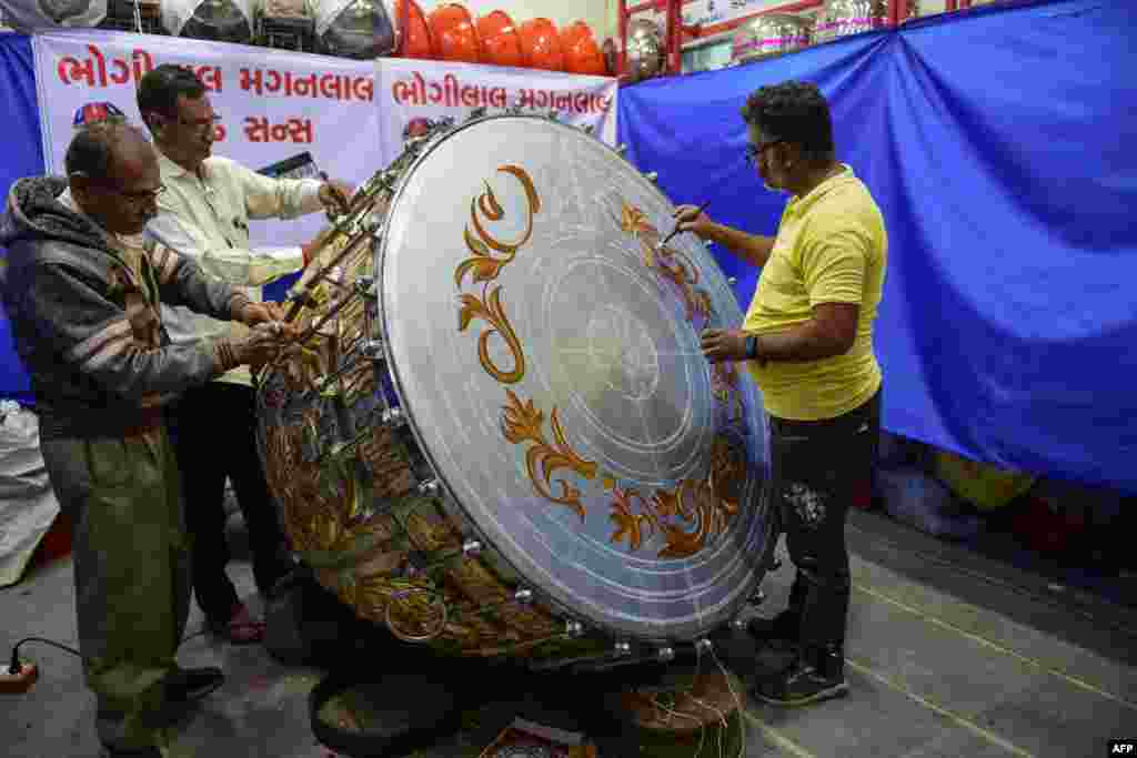 Artisans from Dabgar community works on a huge 'Nagara' (Drum) for a temple to Hindu deity Ram in Ayodhya, in Ahmedabad, India.