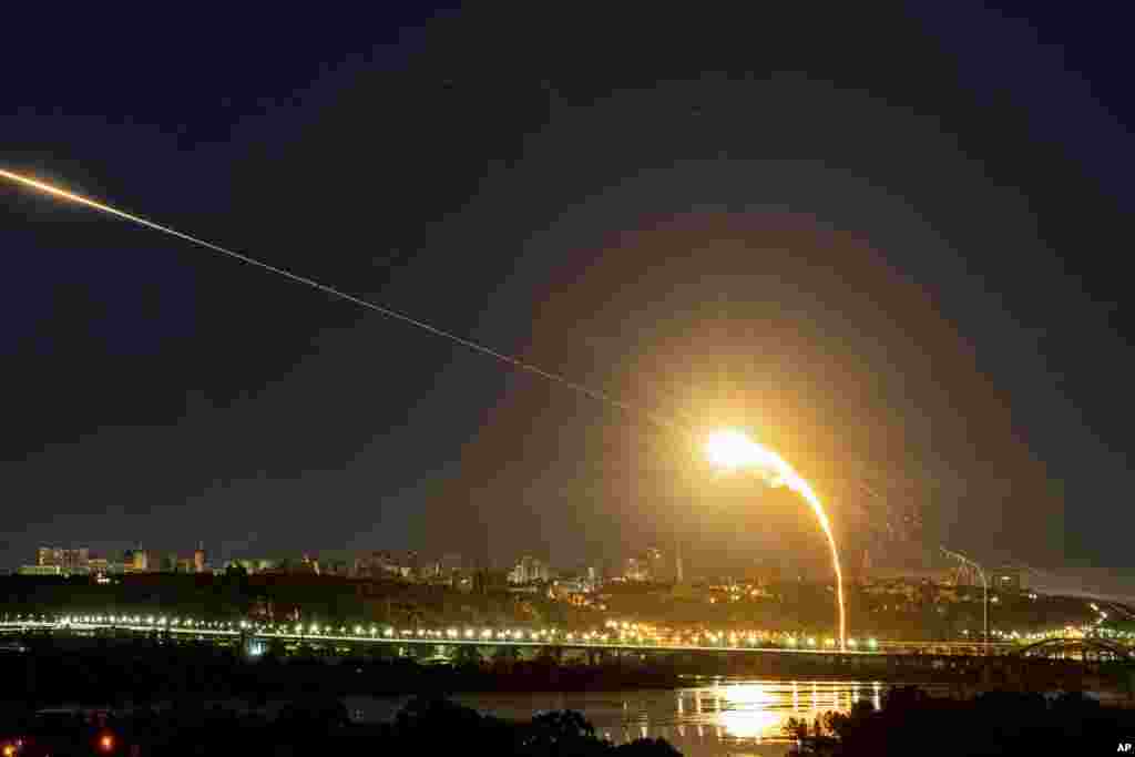 Ukrainian air defense intercepts a Shahed drone mid-air in the third Russia aerial attack on the capital in the last 24 hours in Kyiv, Ukraine.