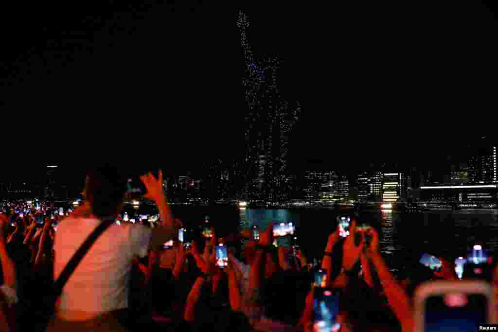 Drones form the shape of the Statue of Liberty as people celebrate U.S. Independence Day in New York City, July 4, 2023.
