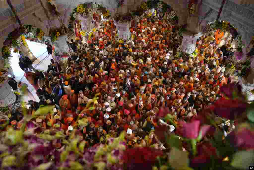 Hindu holy men throng to get the first look of the temple dedicated to Hinduism’s Lord Ram soon after its inauguration in Ayodhya, India. Prime Minister Narendra Modi opened the controversial Hindu temple built on the ruins of a historic mosque in the holy city of Ayodhya in a grand event that is expected to galvanize Hindu voters in upcoming elections. 