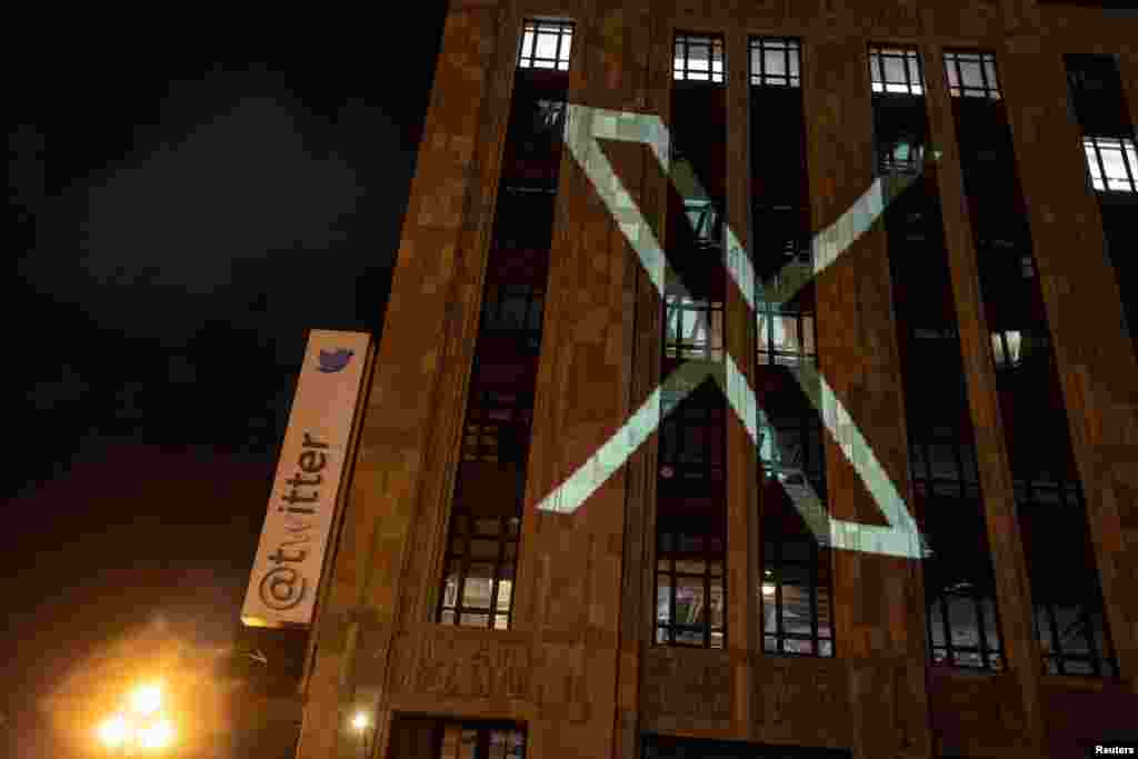 Twitter's new logo is seen projected on the corporate headquarters building in downtown San Francisco, California, July 23, 2023.