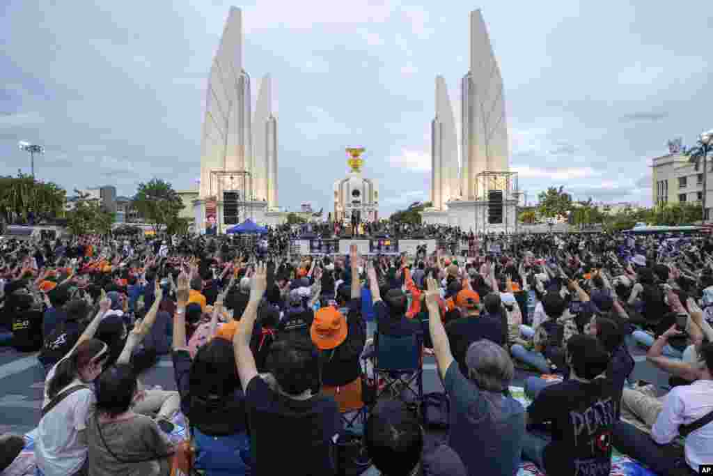 Supporters of the Move Forward Party gather at Democracy Monument during a protest in Bangkok, Thailand. Thailand's Constitutional Court has suspended the party's leader Pita Limjaroenrat, a candidate to become prime minister, from his duties as a member of Parliament pending its ruling on whether he violated an election law. 