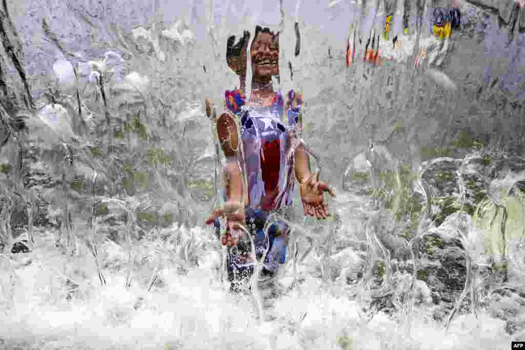 A young boy plays in the water fountain at Yards Park in Washington, D.C.