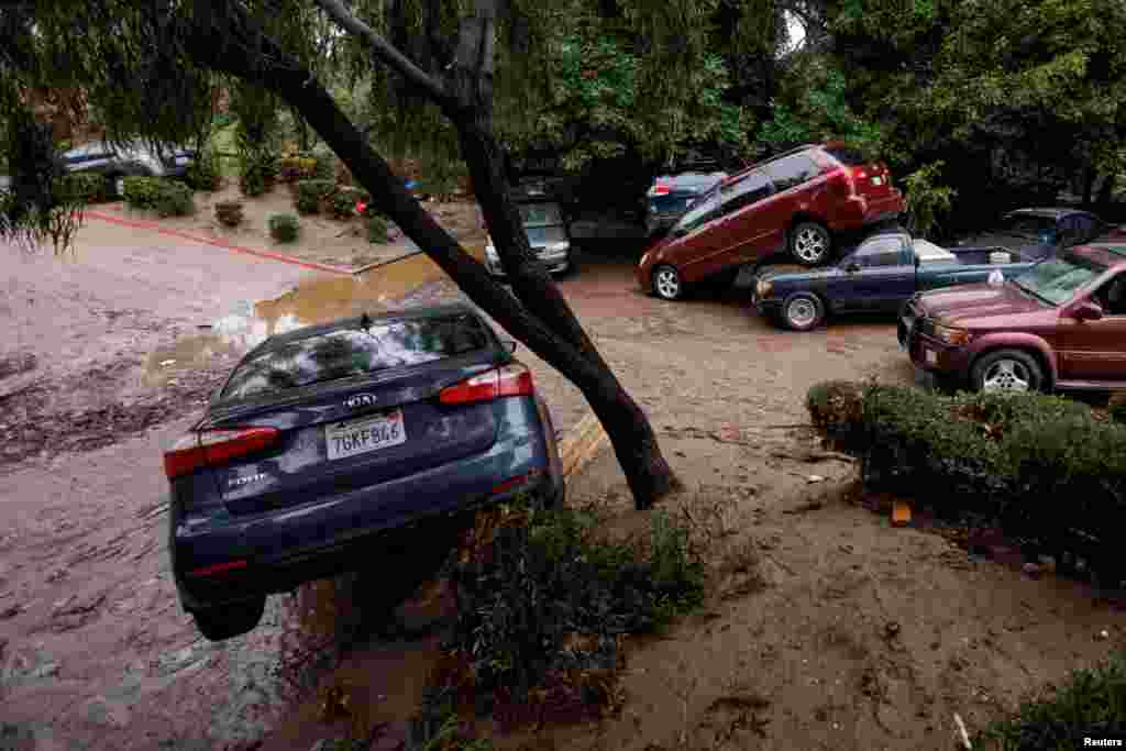 Damage is shown after a heavy rain storm causes a small river to overflow into a neighborhood in San Diego, California, Jan. 22, 2024.