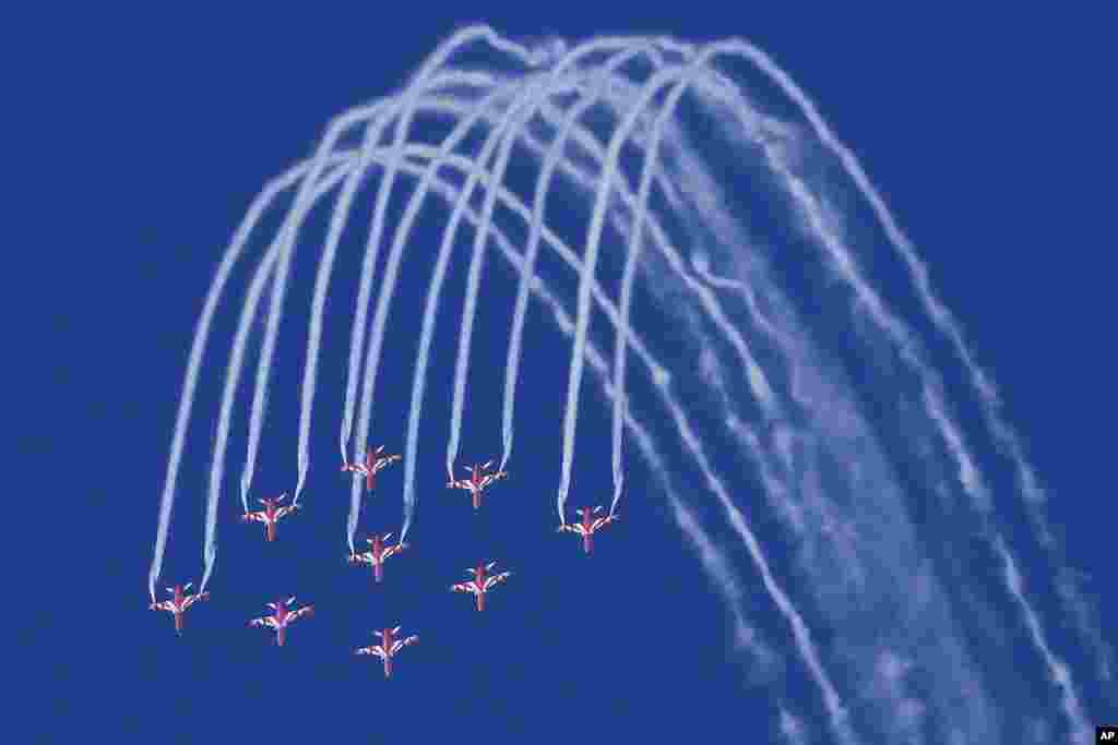 Indian Air force Surya Kiran aerobatics team rehearses for an air show over Marine Drive in Mumbai, India.
