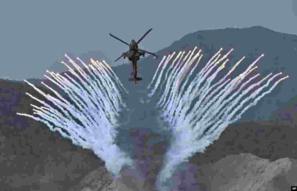 South Korea's Apache AH-64 helicopter fires flares during a South Korea-U.S. joint military drill at Seungjin Fire Training Field in Pocheon, South Korea.