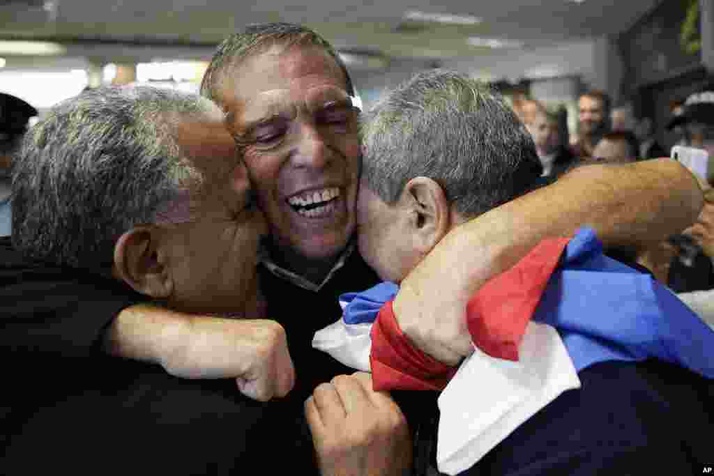 Juan Angel Napout, the former president of soccer's South American governing body, is received by relatives and friends after landing at Silvio Pettirossi Airport in Luque, Paraguay. Napout was released from a federal prison in Miami and deported to Paraguay after serving 5 1/2 years of his sentence for a Dec. 22, 2017, conviction on one count of racketeering conspiracy and two counts of wire fraud conspiracy. 