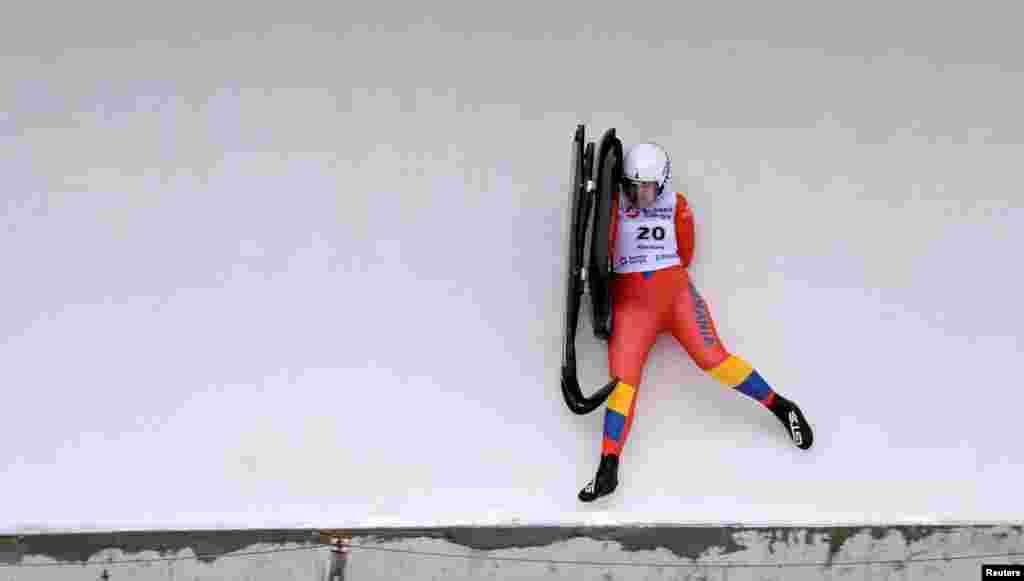 Romania's Iona-Corina Buzatoiu crashes during qualification in the luge at the World Championships in Altenberg, Germany.